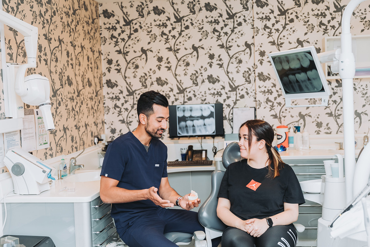 Happy patient looking in a mirror
